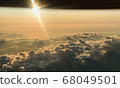 Sea of clouds and sunset as seen from an airplane 68049501