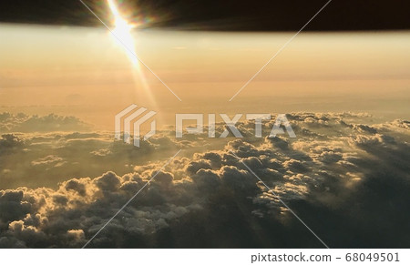 Sea of clouds and sunset as seen from an airplane Sea of clouds and sunset as seen from an airplane 68049501
