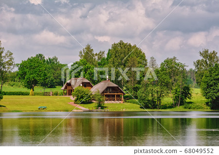 Houses on the bank of the river Houses on the bank of the river 68049552