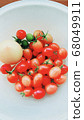 Petit tomatoes in the home garden 68049911