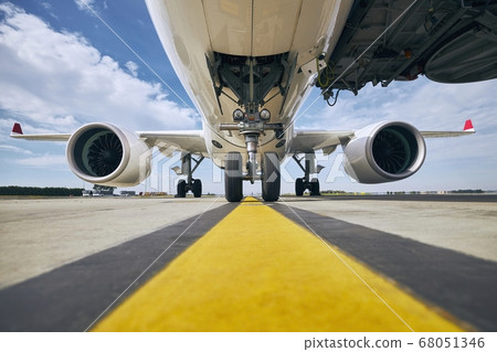 Front view of airplane at airport 68051346