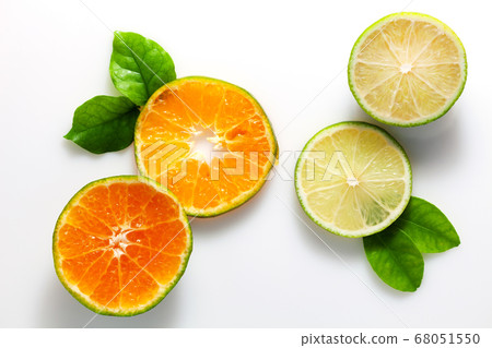 lime and orange fruit on white background. lime and orange fruit on white background. 68051550
