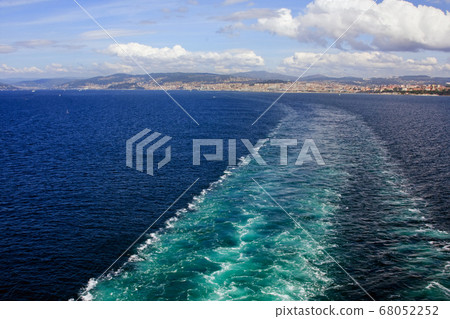 A Ship's Wake. A ship's wake as it departs the port of Vigo in northern Spain. A Ship's Wake. A ship's wake as it departs the port of Vigo in northern Spain. 68052252