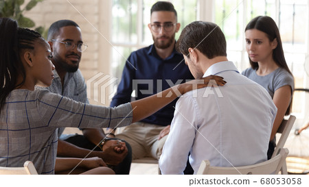 Rear view at upset man feel depression get psychological support 68053058