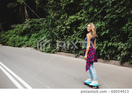 beautiful blonde skates in the park beautiful blonde skates in the park 68054913