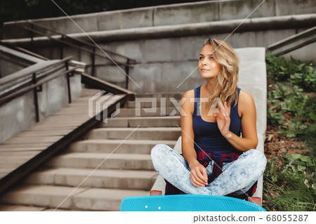 girl posing with skate board girl posing with skate board 68055287