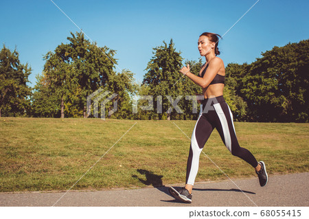 beautiful girl running in the park - Stock Photo [68055415] - PIXTA