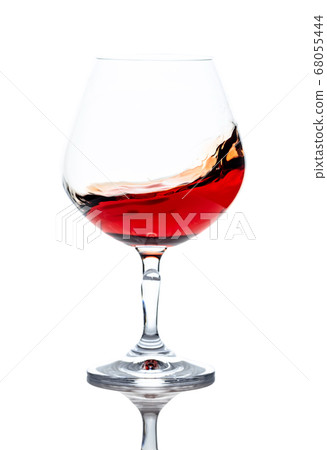 Snifter of brandy isolated on white background. Snifter of brandy isolated on white background. 68055444