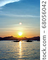Beautiful sunset at the sea. a variety of colors and shades of the rising sun. 68056042