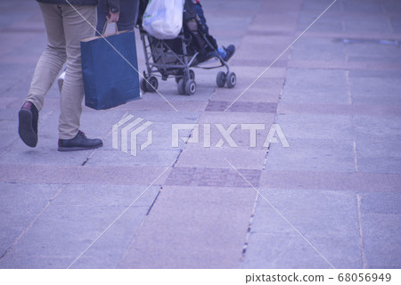 People walking sidewalk pavement 68056949