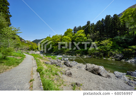 Fresh green Mitake Valley, a promenade along the blue sky and the Tama River 68056997