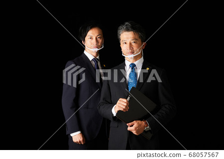 Two male lawyers with a mouse shield [suit lawyer badge] 68057567