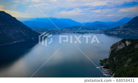 Aerial view over the Lake Lugano in Switzerland - evening view Aerial view over the Lake Lugano in Switzerland - evening view 68058431