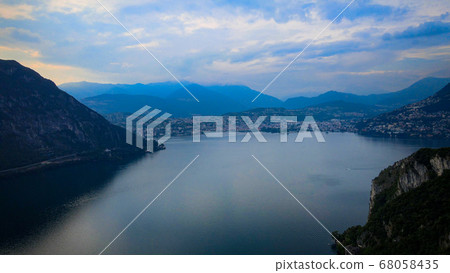 Aerial view over the Lake Lugano in Switzerland - evening view Aerial view over the Lake Lugano in Switzerland - evening view 68058435
