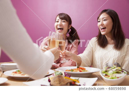 Woman having a Christmas party Woman having a Christmas party 68059898