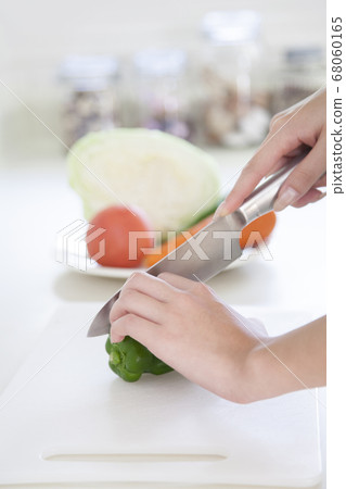 Woman cooking in the kitchen Woman cooking in the kitchen 68060165