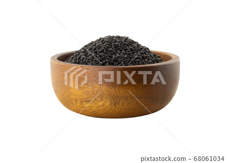 side view of black sesame seeds in wooden bowl side view of black sesame seeds in wooden bowl 68061034