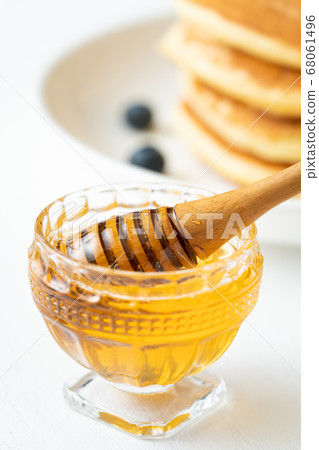 Honey and honey dipper Honey and honey dipper 68061496