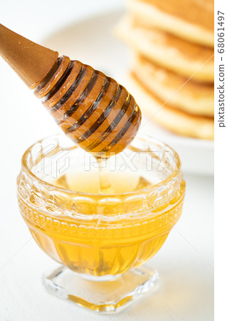 Honey and honey dipper Honey and honey dipper 68061497