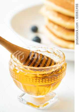 Honey and honey dipper Honey and honey dipper 68061498