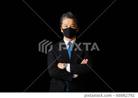 Middle businessman with a mask 68062792