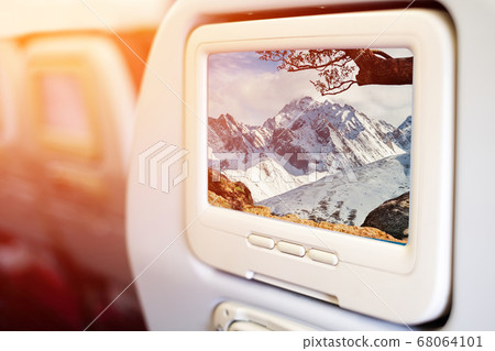 Aircraft monitor in front of passenger seat 68064101