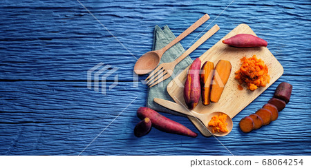 Sweet Potato on wooden cutting board and blank Sweet Potato on wooden cutting board and blank 68064254