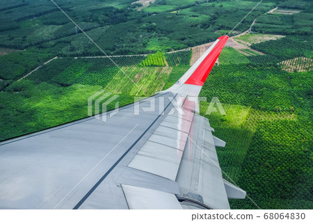 Green field View from Airplane Window 68064830