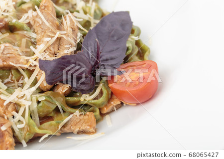 Tagliatelle spinach pasta with beaf and cheese. 68065427