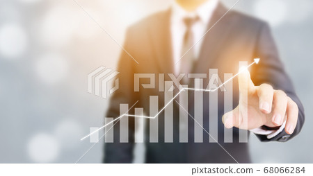 Businessman pointing arrow graph corporate future growth plan 68066284
