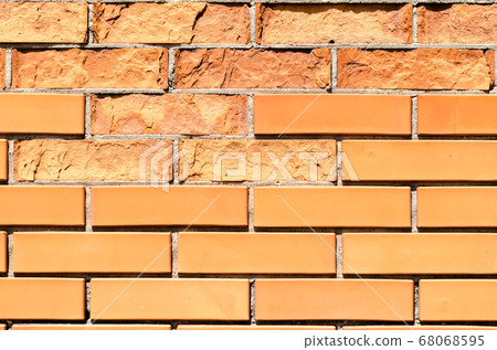 texture orange brick wall with damaged fragments 68068595