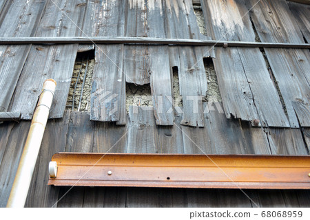 Broken wooden exterior wall 68068959
