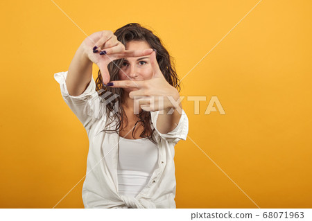 Hands making photo frame, fingers framing distance, photography sign made human 68071963