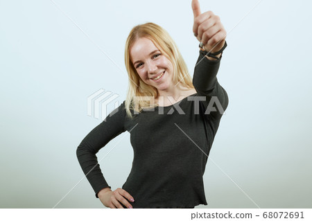 Happy Girl Smiling Raised Her Thumb Up 68072691