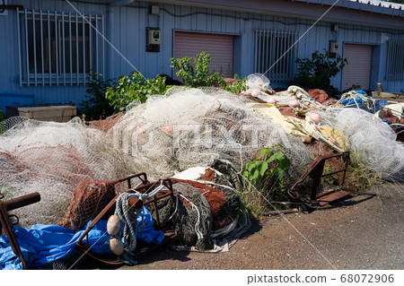 Fishing nets left in one corner of the harbor Fishing nets left in one corner of the harbor 68072906