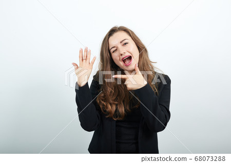 Happy Female Smiling Shows Forefinger On Hand With Five Fingers. Joyful People Happy Female Smiling Shows Forefinger On Hand With Five Fingers. Joyful People 68073288