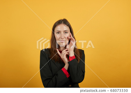 Gentle Female Touches Hands To Her Face. The Concept Of Nice, Kind People Gentle Female Touches Hands To Her Face. The Concept Of Nice, Kind People 68073330