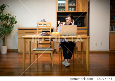Woman working at home, unwell 68073861