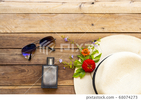 perfume ,sunglasses and hat of lifestyle woman relax summer with purple flowers ,zinnia arrangement flat lay style perfume ,sunglasses and hat of lifestyle woman relax summer with purple flowers ,zinnia arrangement flat lay style 68074273