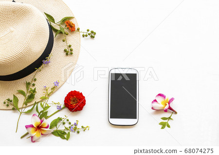 mobile phone ,hat and flower zinnia elegans of lifestyle woman relax arrangement flay lay style mobile phone ,hat and flower zinnia elegans of lifestyle woman relax arrangement flay lay style 68074275