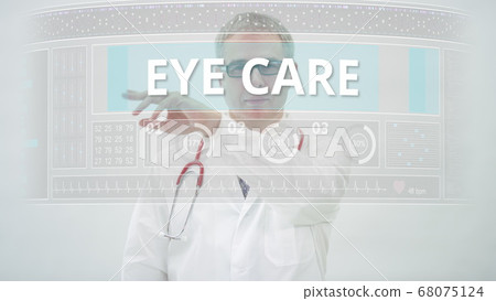 EYE CARE tab is scrolled by a doctor on a modern display 68075124