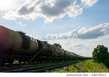 Old barrels of oil on the railway. 68076022