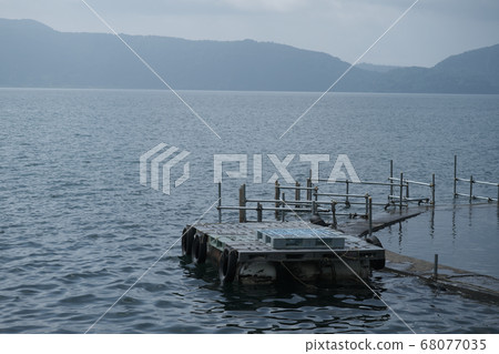Pier floating on the lake Pier floating on the lake 68077035