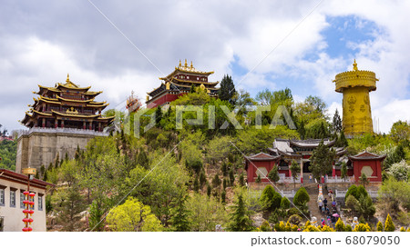 Giant tibetan prayer wheel and Zhongdian temple - Yunnan, China 68079050