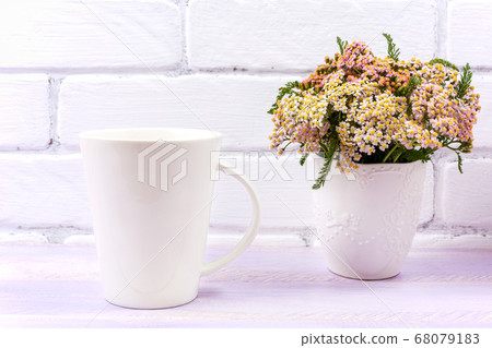 White coffee latte mug mockup with pink yarrow 68079183