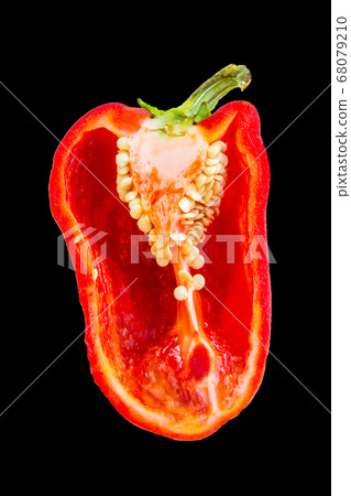 Half a juicy red bell pepper on black background Half a juicy red bell pepper on black background 68079210