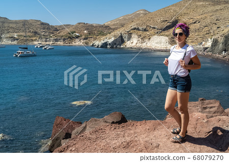 Europe Greece Santorini travel vacation woman on famous santorini Oia island travel destination. Happy young tourist woman. Summer wanderlust. 68079270