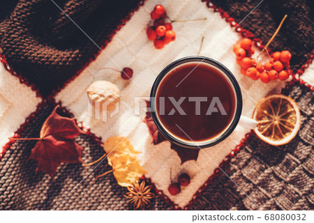 Autumn hot steaming cup of coffee or tea. Autumn hot steaming cup of coffee or tea. 68080032