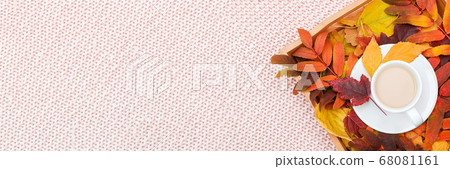 Cup of coffee with milk and colorful leaves on Cup of coffee with milk and colorful leaves on 68081161