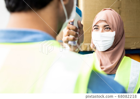 Islam Muslim asian warehouse worker take Islam Muslim asian warehouse worker take 68082218